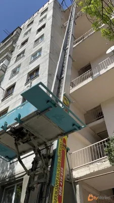 Construction materials on high floors with crane giraffe
