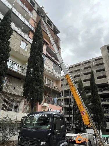 Photo 3 of Lifting the cargo to the floors with a crane elevator with a giraffe